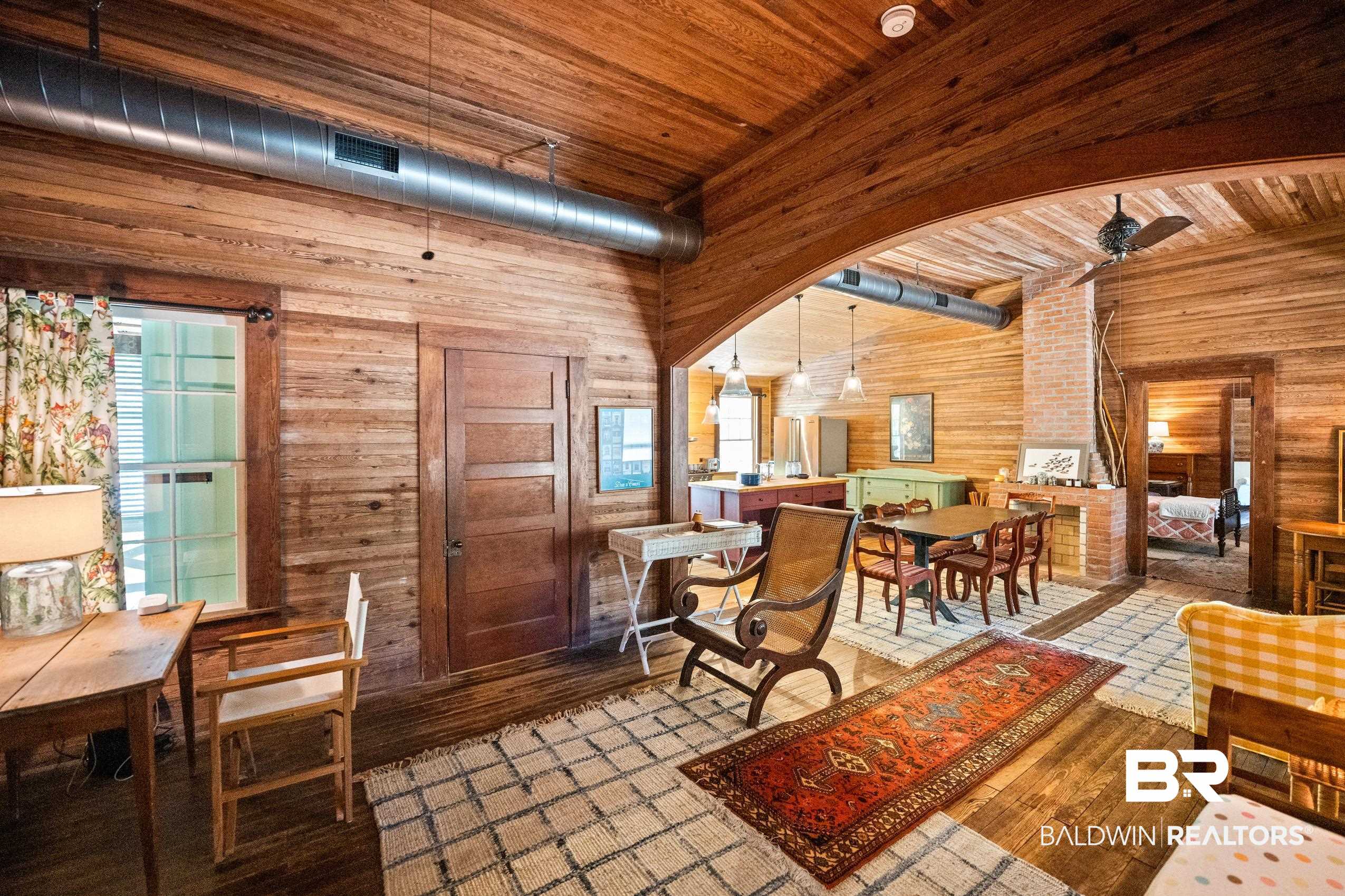 30671 Magnolia Street Elberta, AL 36530 - Photo 21 of 68 Dining space with visible vents, wood walls, wooden ceiling, and wood finished floors