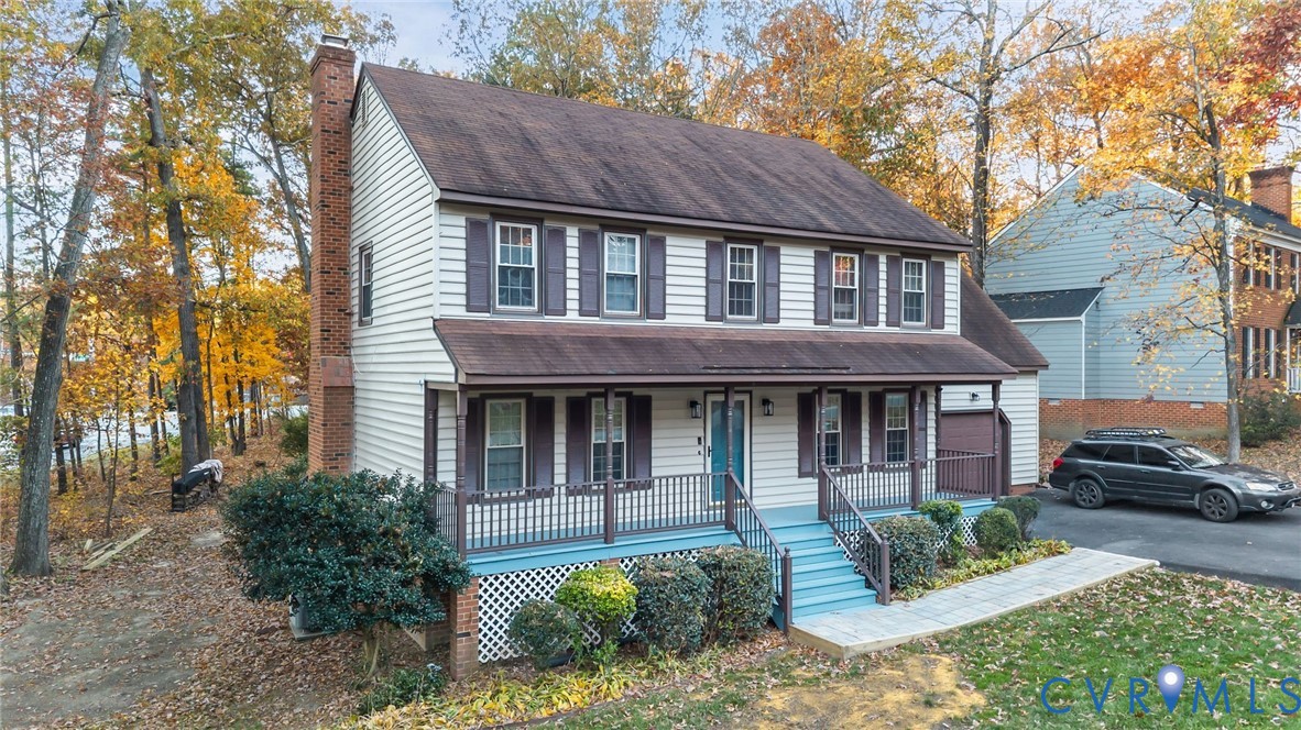 12601 Cottage Mill Road Midlothian, VA 23114 - Photo 2 of 50 a view of a house with a yard plants and a large tree