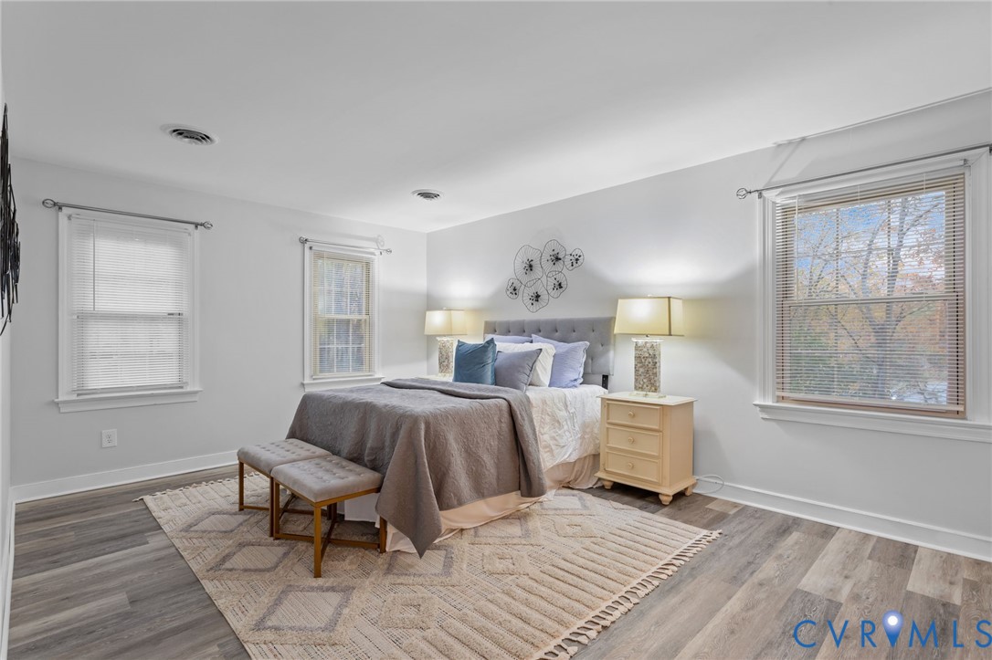 12601 Cottage Mill Road Midlothian, VA 23114 - Photo 30 of 50 a bedroom with a bed and wooden floor