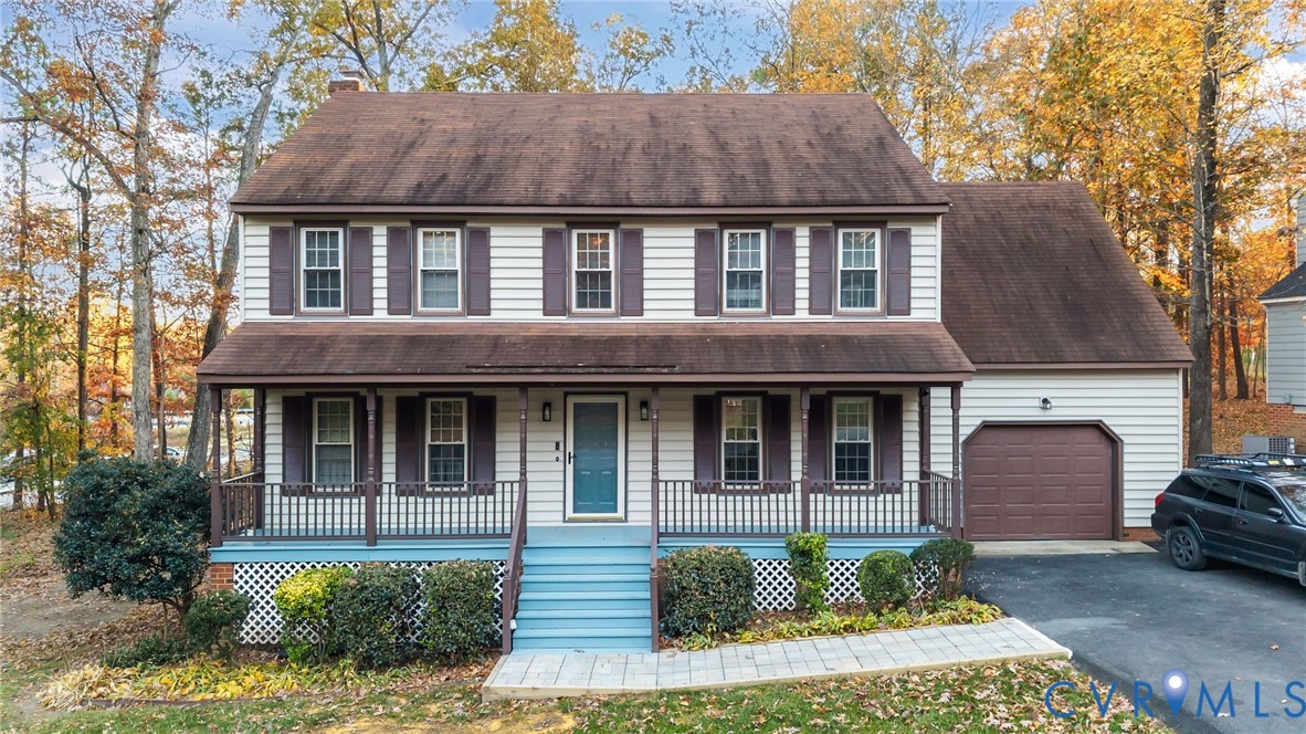 12601 Cottage Mill Road Midlothian, VA 23114 - Photo 3 of 50 a front view of a house with garden