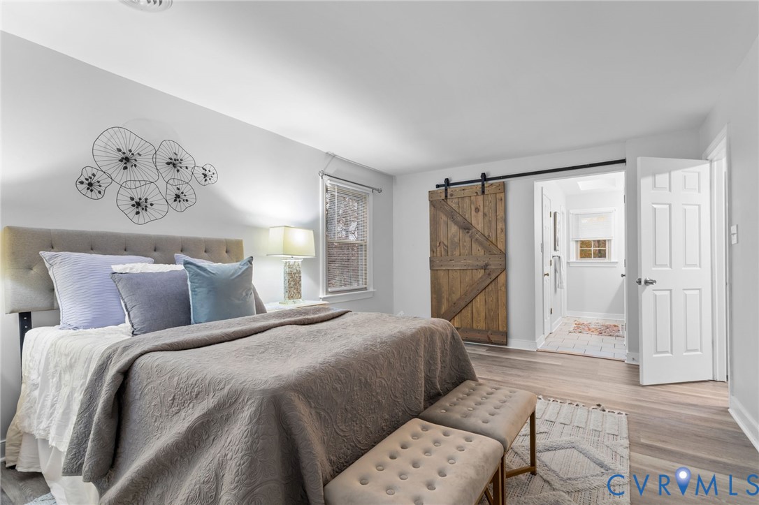 12601 Cottage Mill Road Midlothian, VA 23114 - Photo 31 of 50 a bedroom with a large bed and a painting on the wall