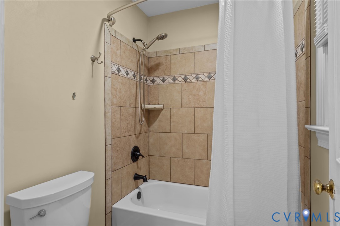 12601 Cottage Mill Road Midlothian, VA 23114 - Photo 34 of 50 a bathroom with a shower a toilet and a sink