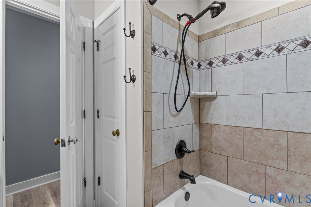 12601 Cottage Mill Road Midlothian, VA 23114 - Photo 36 of 50 a bathroom with a shower and white walls