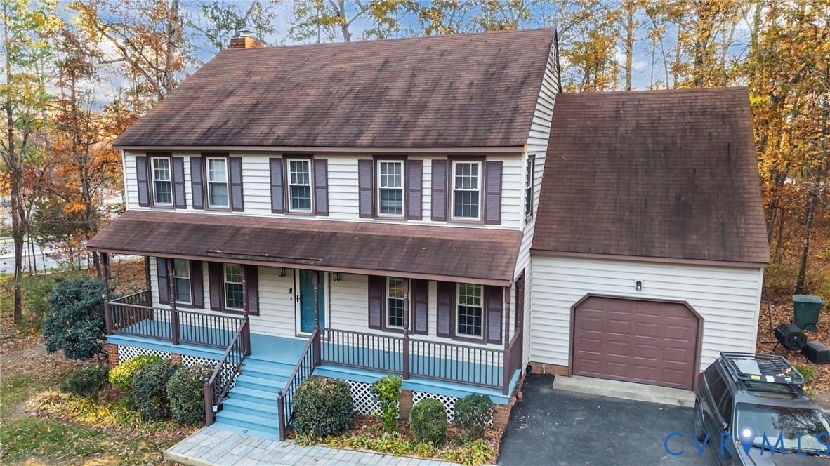 12601 Cottage Mill Road Midlothian, VA 23114 - Photo 4 of 50 a front view of a house with a yard