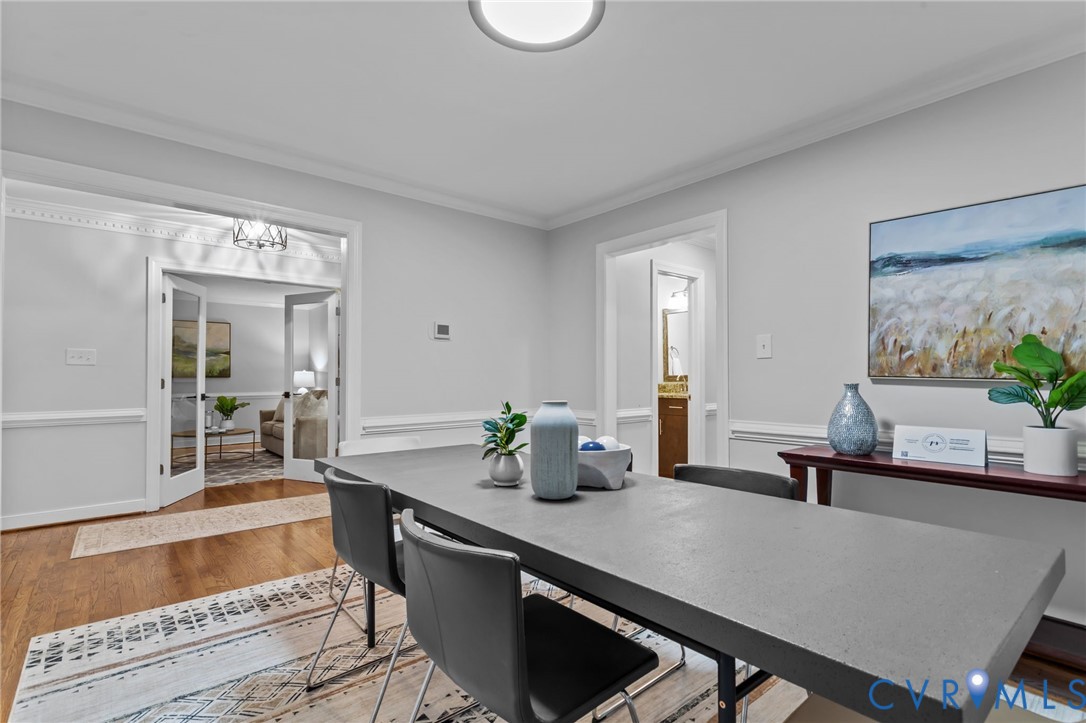 12601 Cottage Mill Road Midlothian, VA 23114 - Photo 43 of 50 a room with wooden floor table and chairs