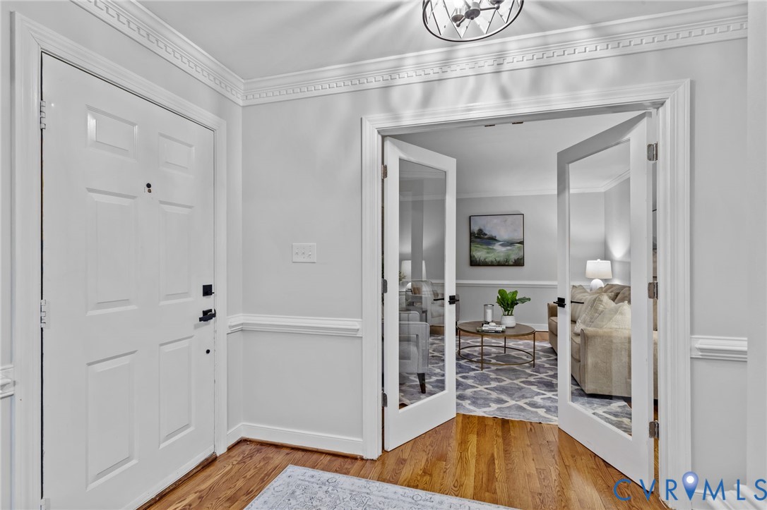 12601 Cottage Mill Road Midlothian, VA 23114 - Photo 50 of 50 a view of a hallway with wooden floor and a living room