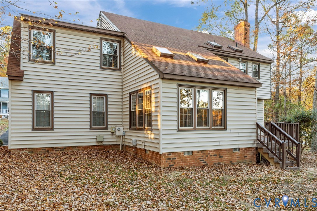 12601 Cottage Mill Road Midlothian, VA 23114 - Photo 9 of 50 a view of a house with a yard and wooden fence