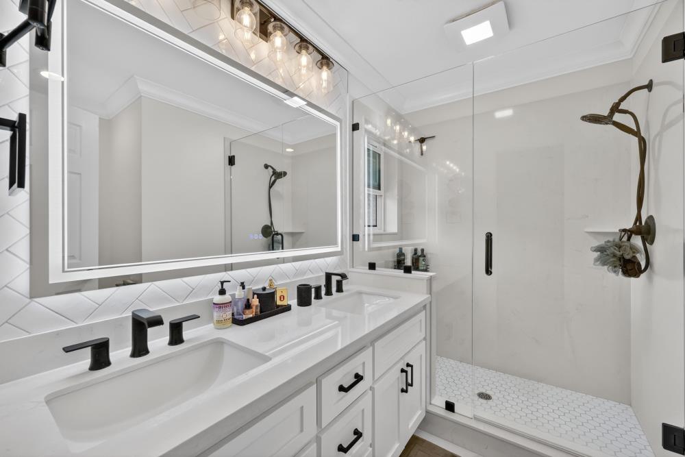 3340 Garden Bar Road Lincoln, CA 95648 - Photo 26 of 56 a bathroom with a sink double vanity and shower