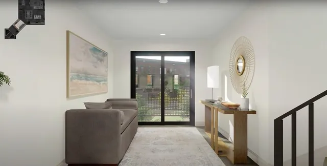 a living room with furniture and a floor to ceiling window