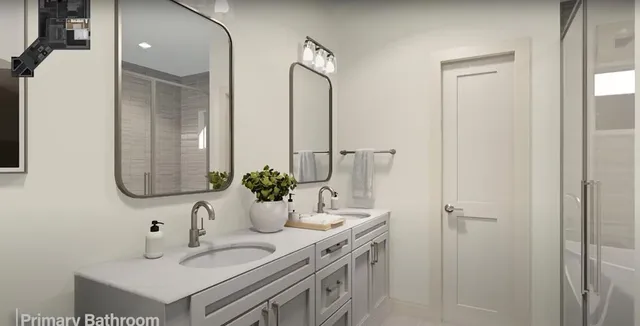 a bathroom with a double vanity sink mirror and