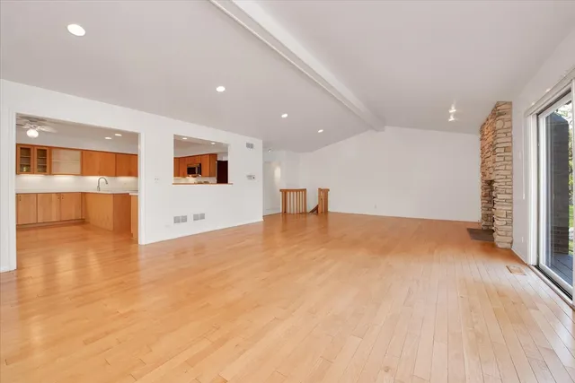 a kitchen with a sink and a large window