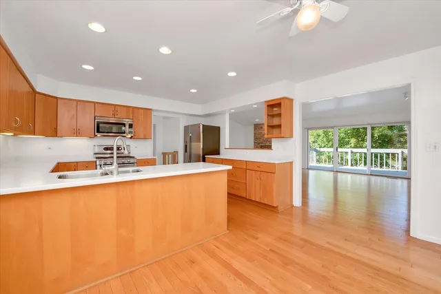 a living room with furniture and large windows