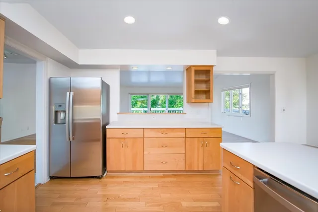 a bedroom with a large bed and a large window