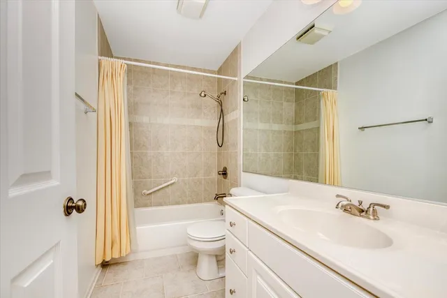 a view of a hallway with wooden shelves