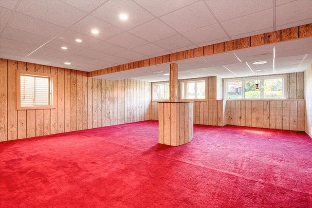 a view of balcony with furniture and garden
