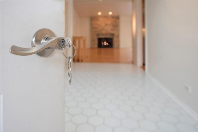 a view of a room with an empty space and a window