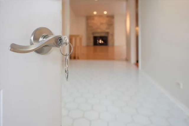 a view of a room with an empty space and a window