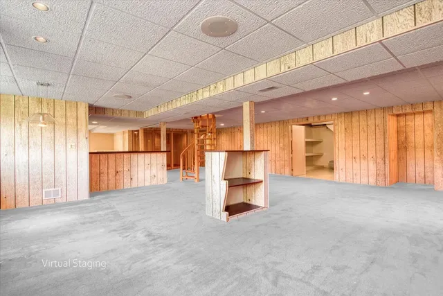 a view of a garden with a house in the background