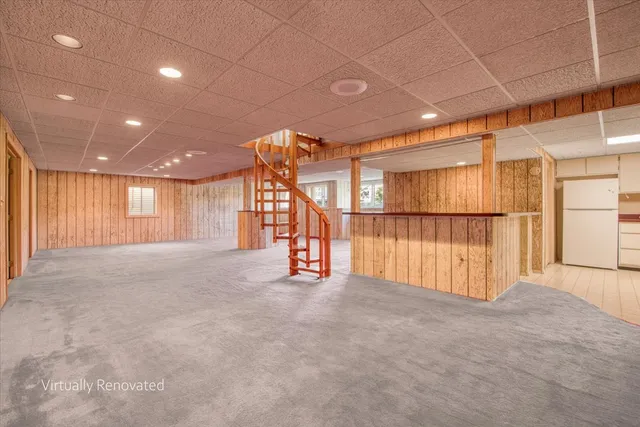 a view of a house with a yard and a pond