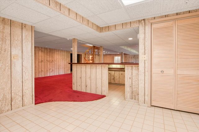 a view of a garden with lake and trees