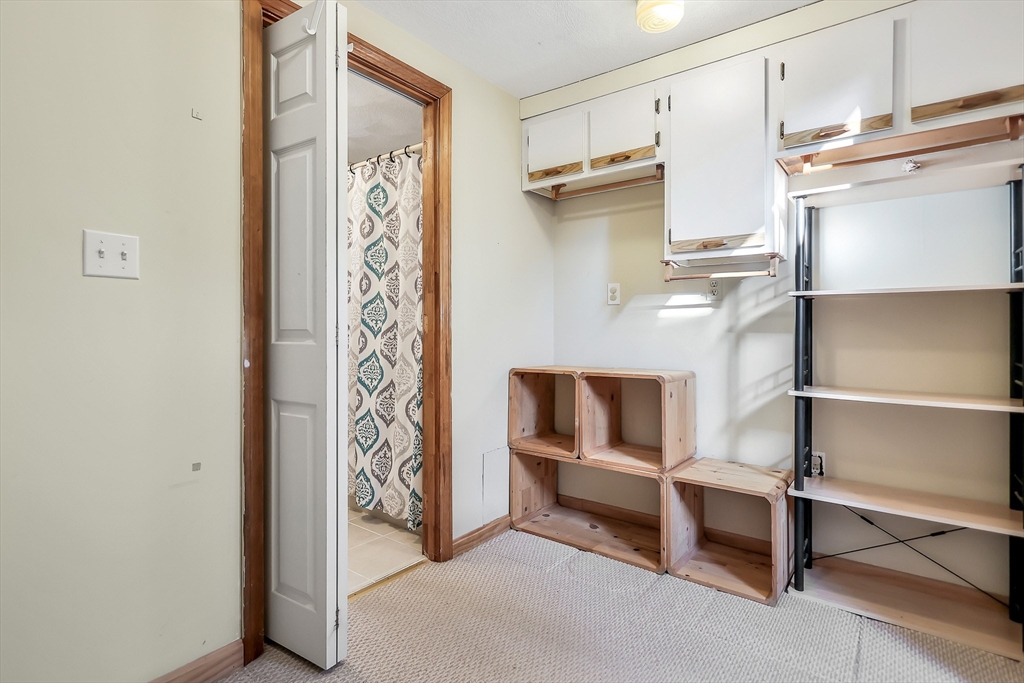 11 Warwick Street, Unit 3 Lowell, MA 01851 - Photo 15 of 23 a view of walk in closet with empty racks