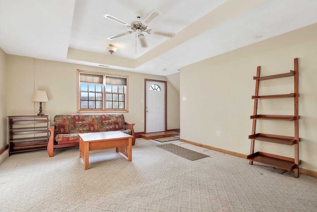 11 Warwick Street, Unit 3 Lowell, MA 01851 - Photo 3 of 23 a bedroom with furniture and window