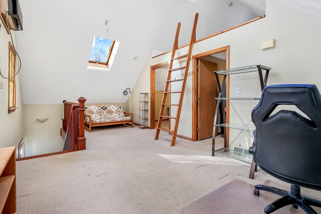 11 Warwick Street, Unit 3 Lowell, MA 01851 - Photo 9 of 23 a view of a room with gym equipment
