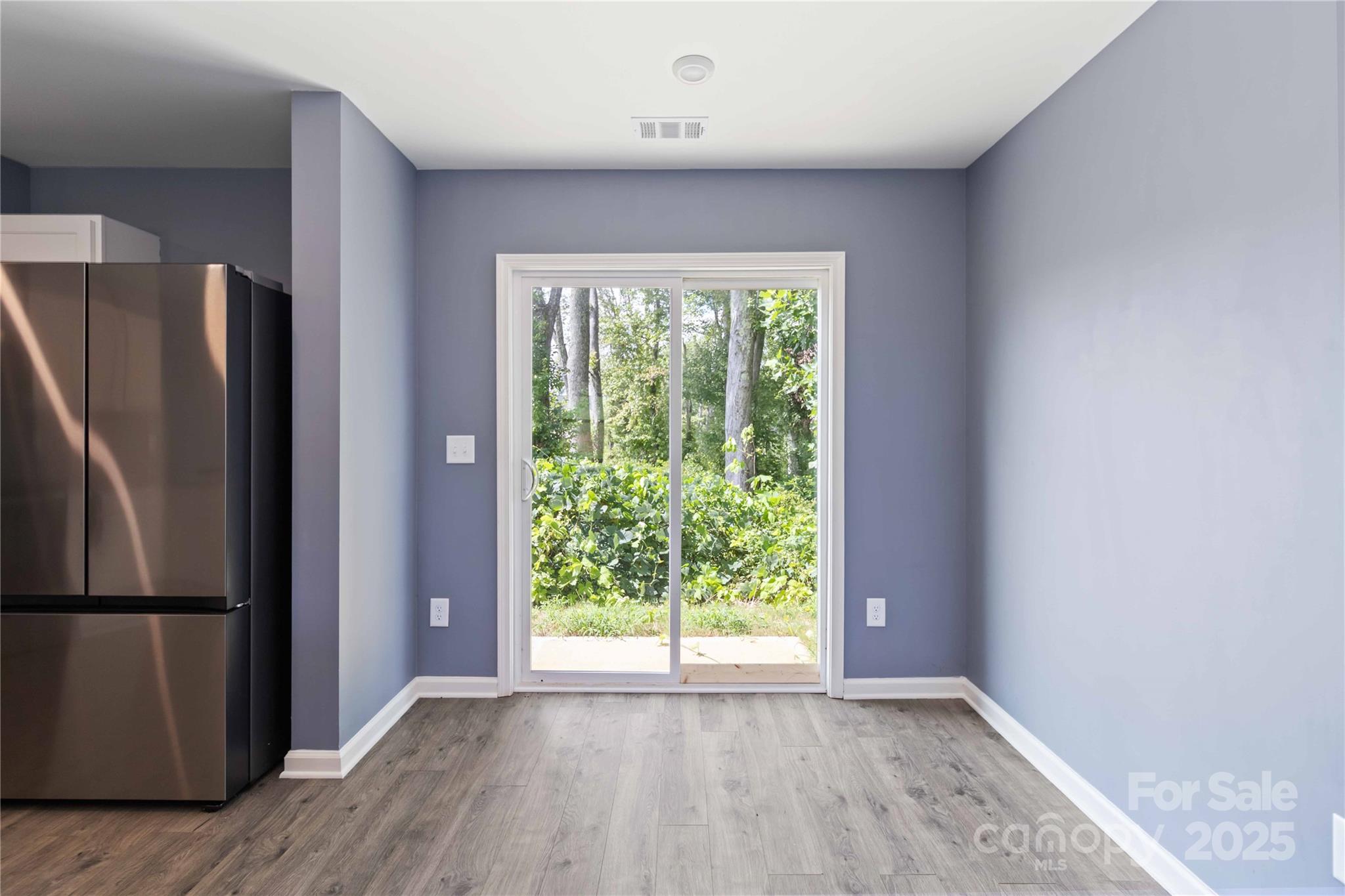 157 Emory Road Cowpens, SC 29330 - Photo 8 of 30 a view of an empty room with wooden floor and a window
