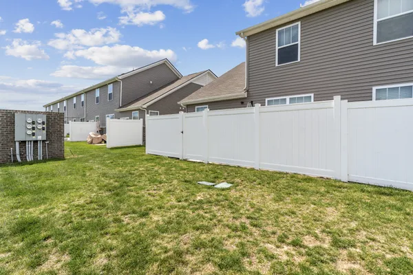 a view of a house with a backyard