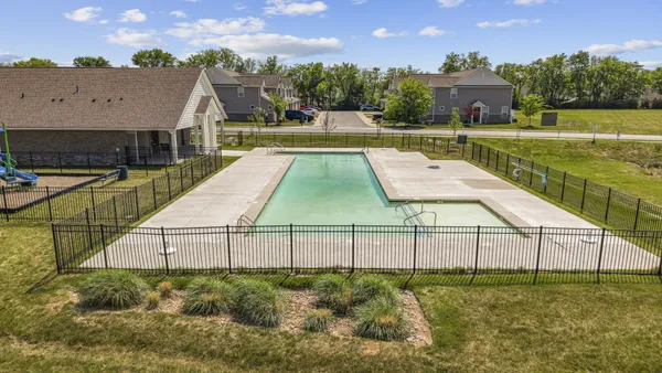an aerial view of a house with swimming pool