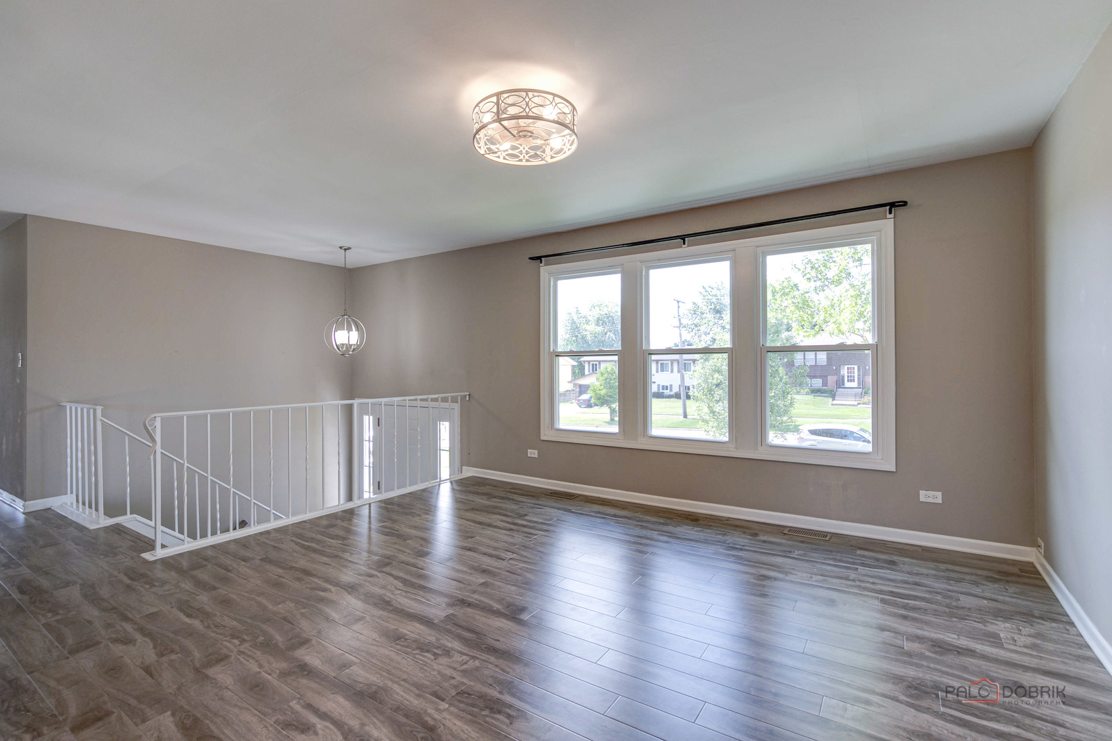 1030 Hassell Road Hoffman Estates, IL 60169 - Photo 11 of 35 a view of an empty room with wooden floor and a window