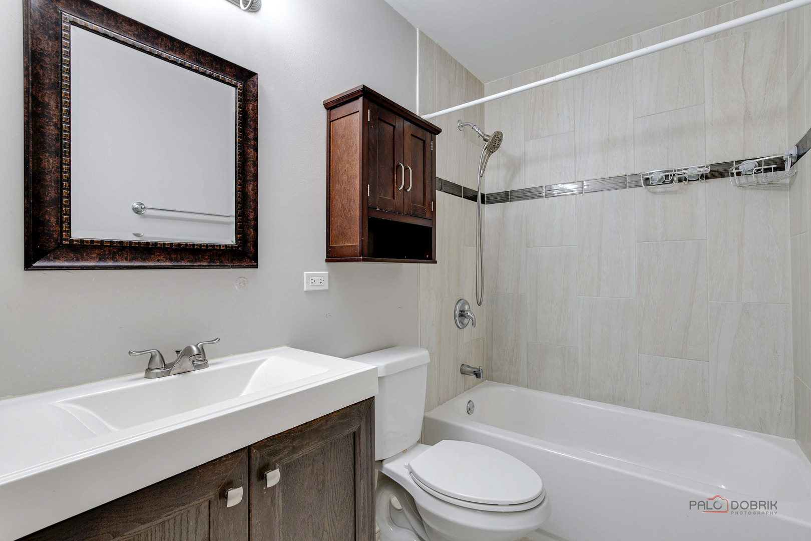 1030 Hassell Road Hoffman Estates, IL 60169 - Photo 14 of 35 a bathroom with a sink a toilet a mirror a vanity and shower