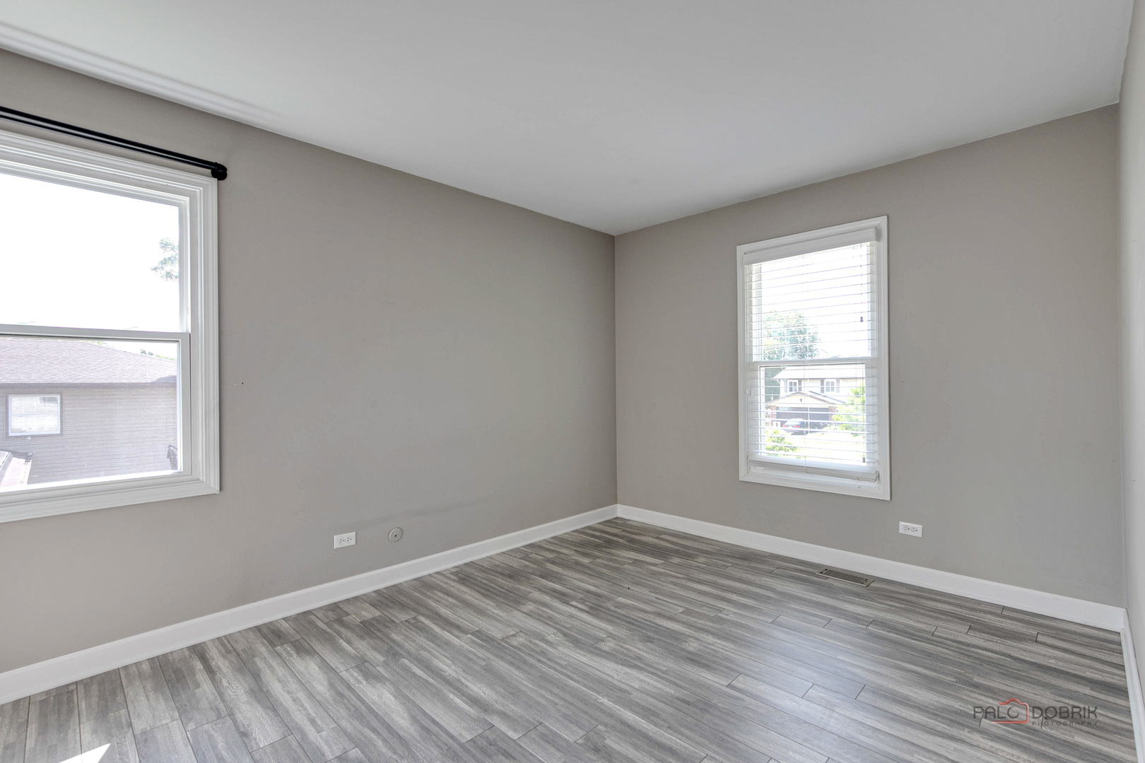 1030 Hassell Road Hoffman Estates, IL 60169 - Photo 17 of 35 a view of an empty room with wooden floor and a window