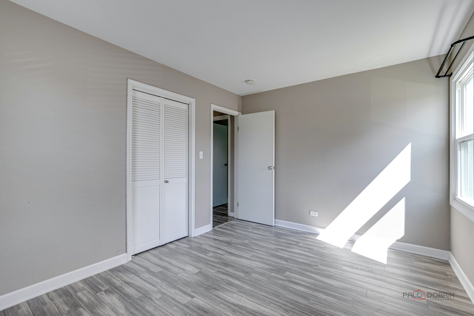 1030 Hassell Road Hoffman Estates, IL 60169 - Photo 18 of 35 a view of an empty room with wooden floor