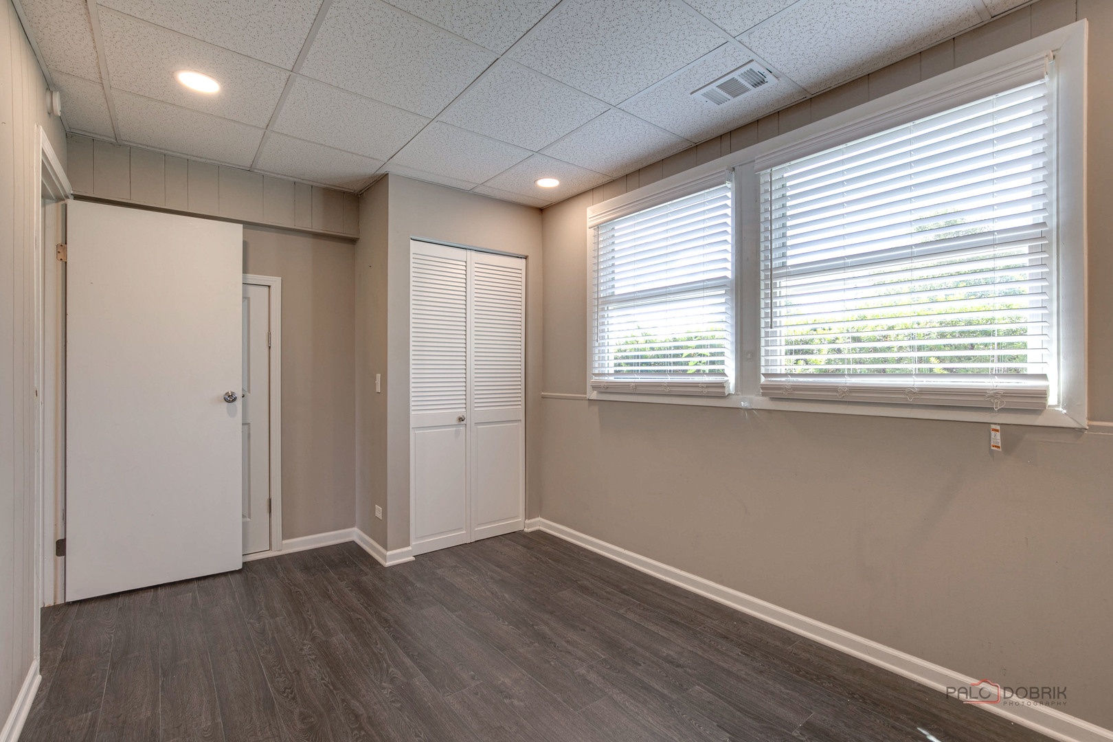 1030 Hassell Road Hoffman Estates, IL 60169 - Photo 22 of 35 a view of an empty room with wooden floor and a window