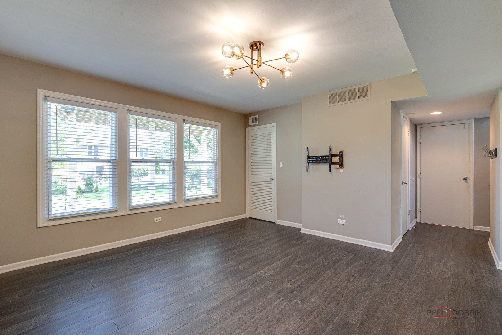 1030 Hassell Road Hoffman Estates, IL 60169 - Photo 24 of 35 a view of an empty room with wooden floor and a window