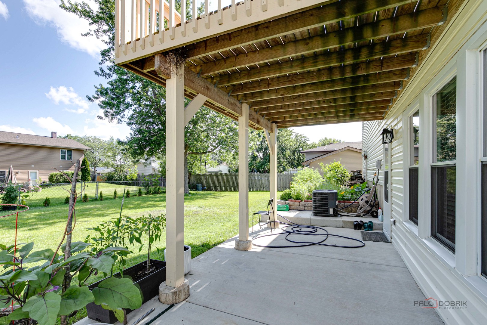 1030 Hassell Road Hoffman Estates, IL 60169 - Photo 28 of 35 a house view with a sitting space and garden view