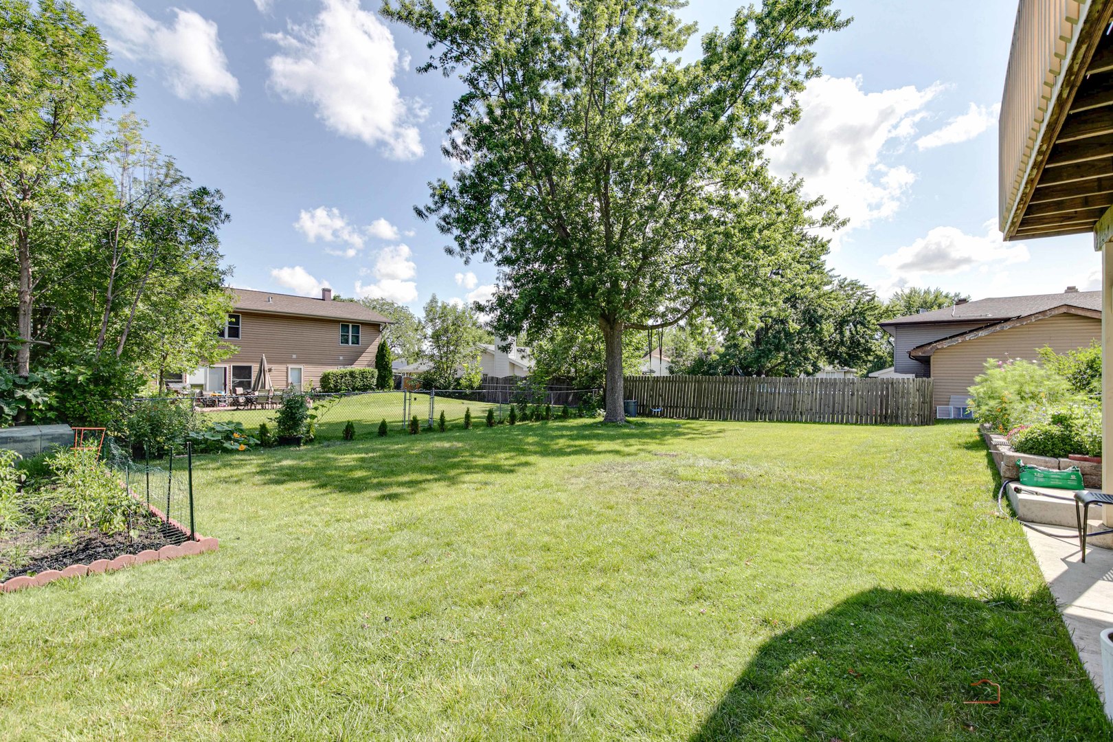 1030 Hassell Road Hoffman Estates, IL 60169 - Photo 32 of 35 a view of a house with a yard porch and sitting area