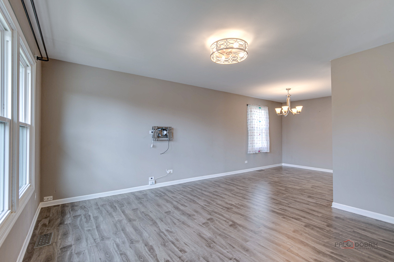 1030 Hassell Road Hoffman Estates, IL 60169 - Photo 9 of 35 a view of an empty room with window and wooden floor