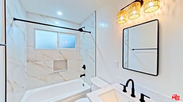 a bathroom with a shower and a sink