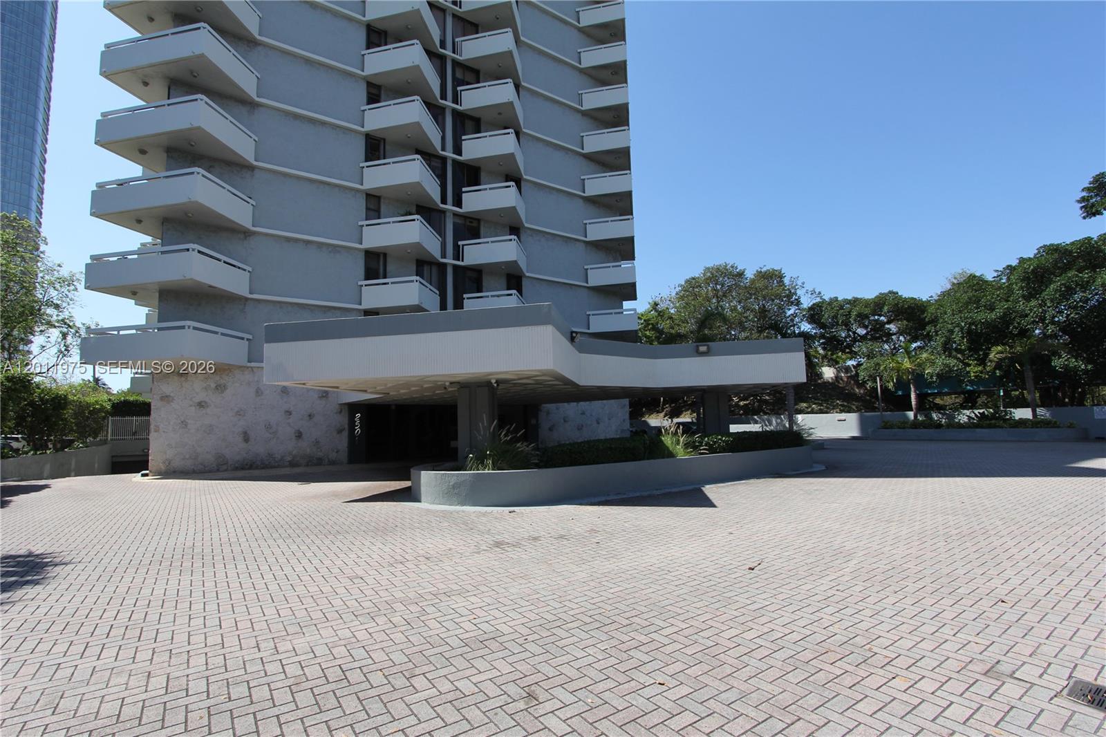 2501 Brickell Avenue, Unit 804 Miami, FL 33129 - Photo 18 of 18 Building entrance features a covered drop-off/pick-up area and ample guest parking