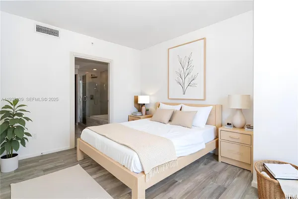 a bathroom with a double vanity sink toilet and shower