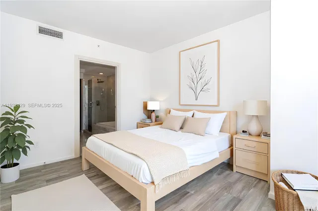 a bathroom with a double vanity sink toilet and shower