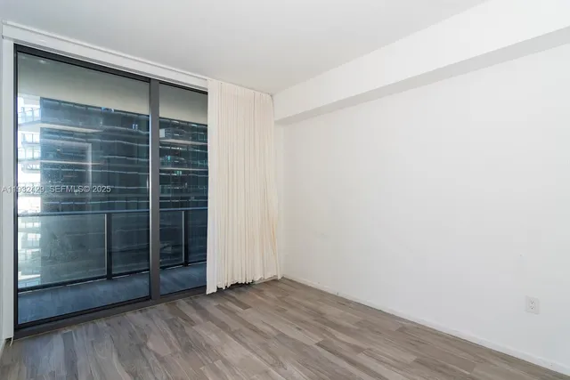 a bathroom with a sink vanity mirror and toilet