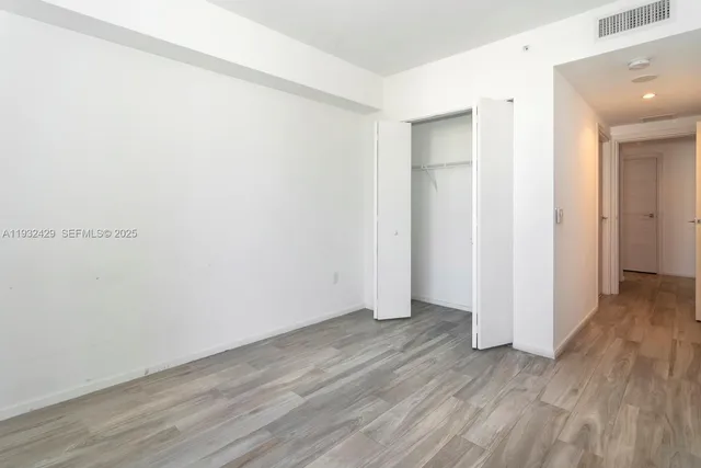 a bathroom with a shower a toilet and a sink