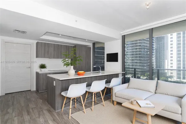 a dining room with furniture and window