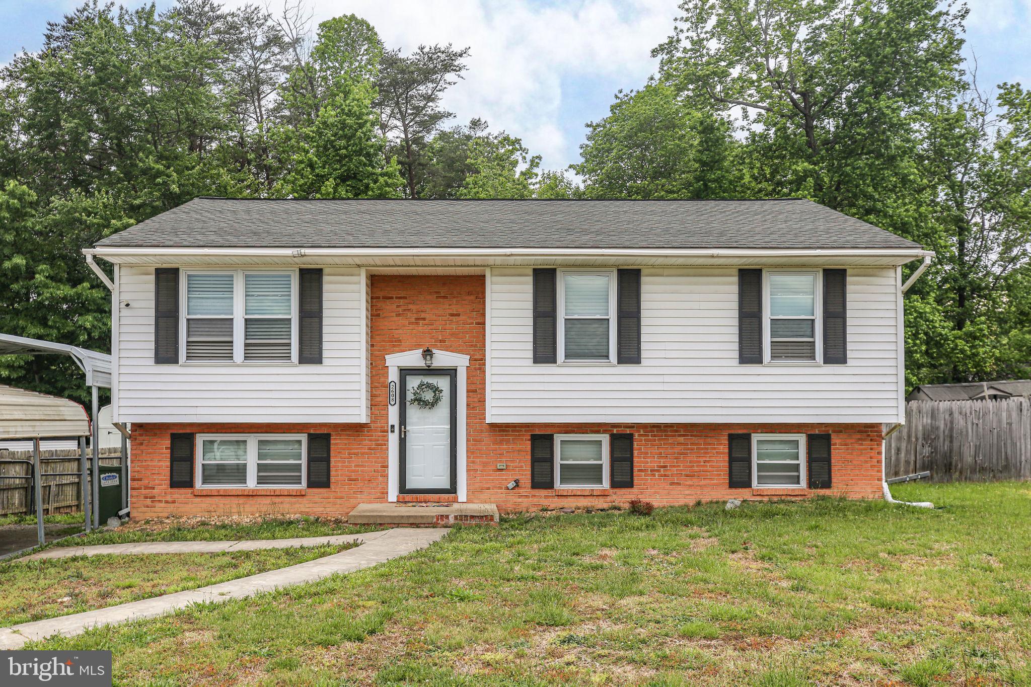2608 Salem Church Road Fredericksburg, VA 22407 - Photo 1 of 1 a front view of a house with a garden
