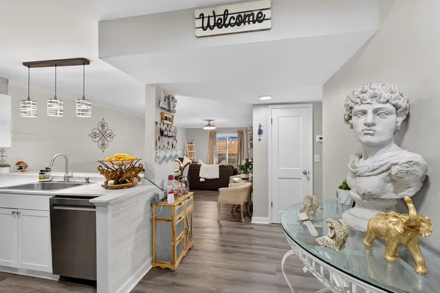 a kitchen view of a dining table chairs and chandelier