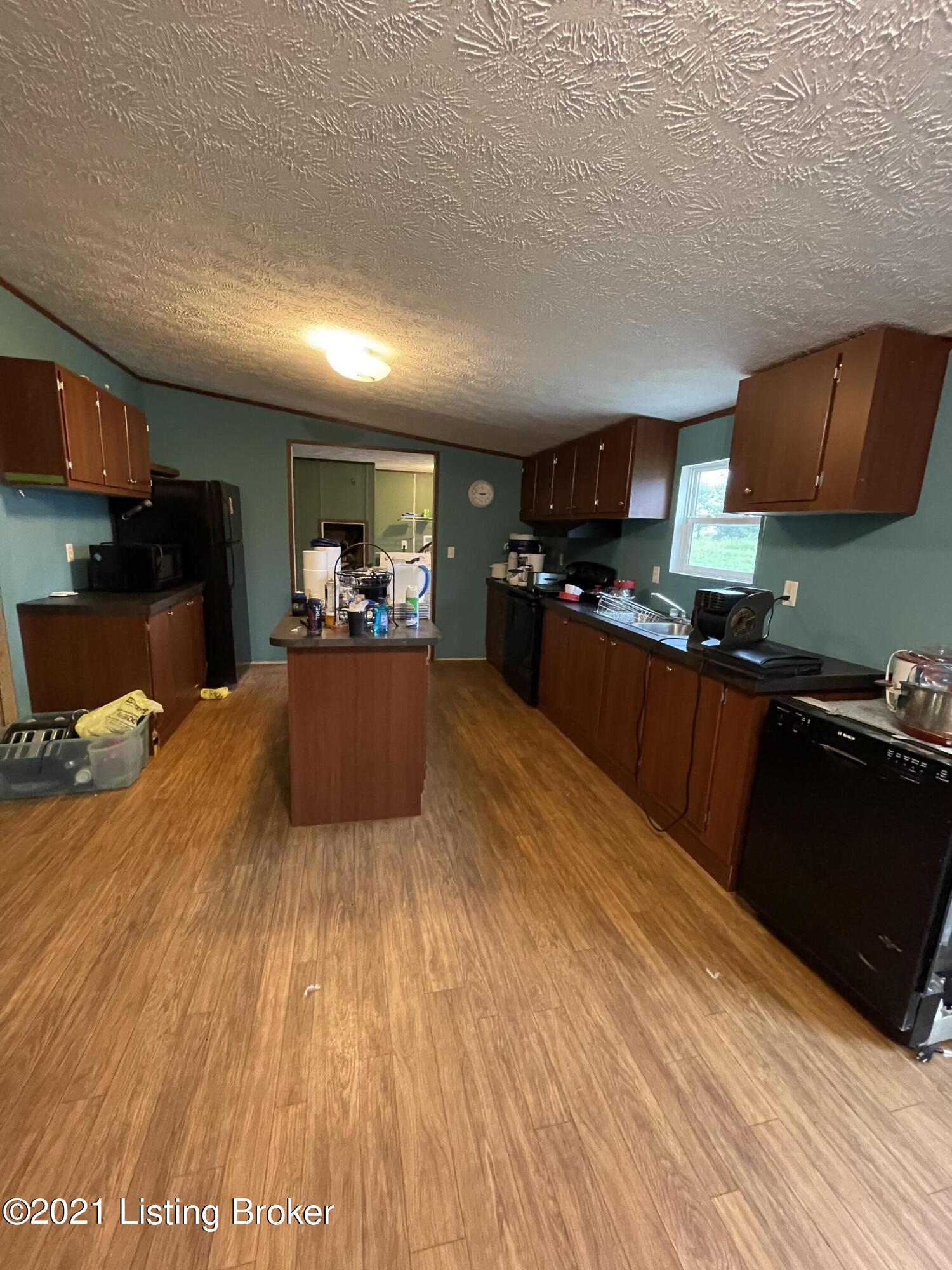 660 Camp Ground Road Bloomfield, KY 40008 - Photo 12 of 13 This kitchen has so much counter space for cooking. Plus, you get an island and a coffee bar as a bonus.
