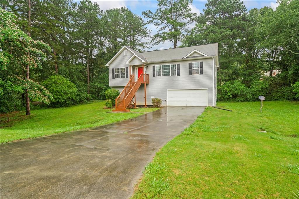 a view of a house with a yard porch and sitting area